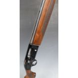 Beretta A303 12 bore semi-automatic shotgun with engraved locks, chequered semi-pistol grip,