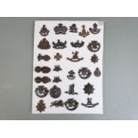 Twenty eight British Army officers' cap and collar badges including Royal Gloucestershire Hussars,