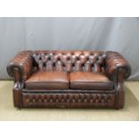 Oxblood leather Chesterfield sofa bed, length 170cm