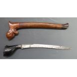 A Polynesian / Kris style dagger with sheath. Blade length 22cm.