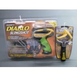 Two Barnett slingshots/catapults Diablo and Strike Nine, both new in original packaging