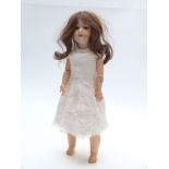 Armand Marseille bisque headed doll with open mouth, weighted blue eyes, long brown hair and