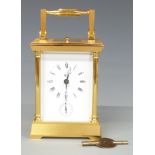 Dent of London 20thC brass carriage clock, with reeded pillars to corners, enamelled Roman dial with