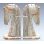 Pair of carved stone Art Deco style bookends in the form of horses, height 27cm
