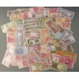 Over 100 African and Asian/Oriental banknotes including Victoria, Cambodia, Chinese hell notes,