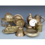 A collection of brassware including Arts and Crafts hammered caddy, globe, fire extinguisher,