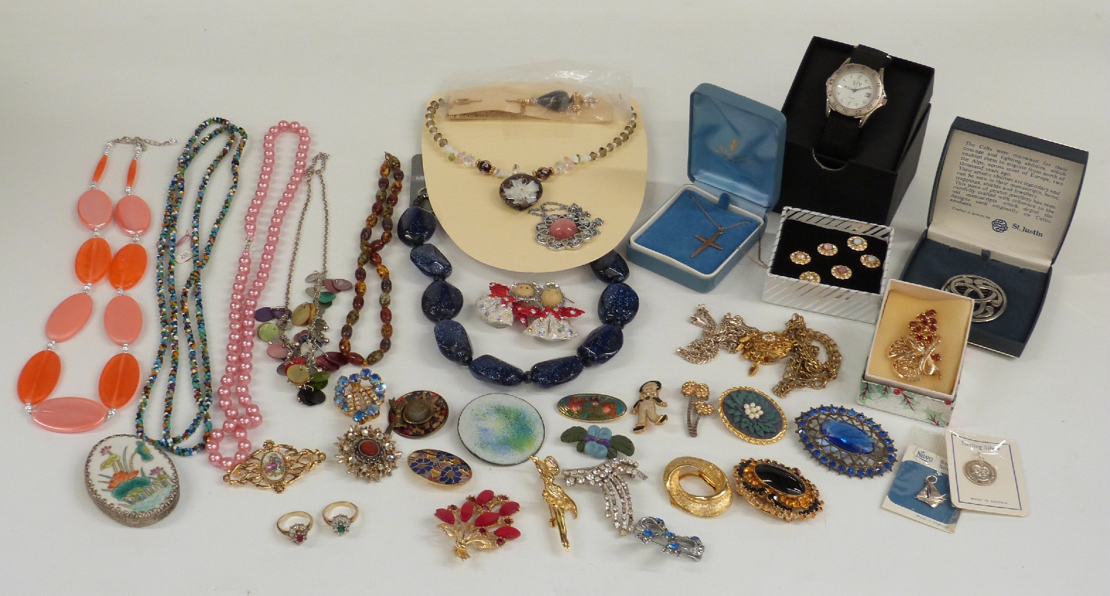 A collection of costume jewellery including 9ct gold crucifix and chain, silver necklace,