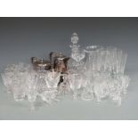 A collection of glass and silver plated items to include Stuart Crystal decanter with suite of