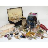 A collection of costume jewellery including two 9ct gold rings, 9ct gold earrings, costume jewellery