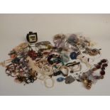 A collection of costume jewellery including earrings, necklaces, brooches,etc