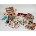 A collection of costume jewellery including a Mizpah brooch, silver locket, silver cross etc