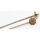 A 15ct gold stick pin set with an amethyst and seed pearls and a 9ct gold stick pin set with