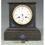 A black slate mantel clock with inlaid lapis lazuli or similar and two train movement striking on