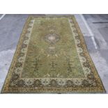 Large Axminster rug with green ground, 455 x 275cm