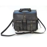 A black leather doctor's bag with shoulder strap