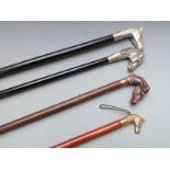 Four walking canes with novelty horse handles