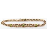 Edwardian 9ct gold bracelet set with seed pearls and peridot, 4.8g