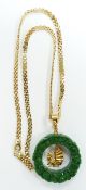 An 18ct gold necklace with a jadeite style pendant