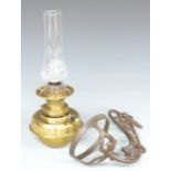 Brass oil lamp with a cast iron wall bracket