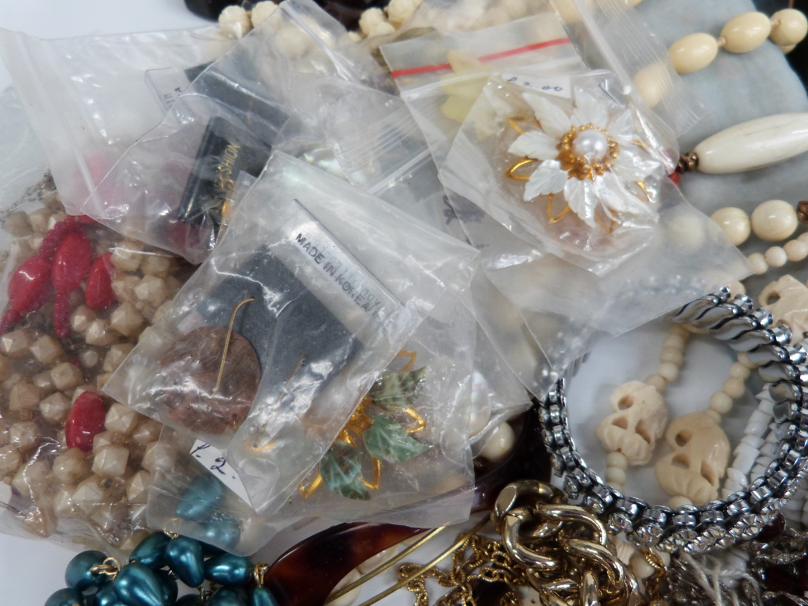 A large collection of costume jewellery including brooches, beads, bracelets, cufflinks, chains, - Image 2 of 14