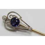 Art Nouveau stick pin set with a round cut natural, untreated colour change sapphire of