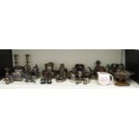 A quantity of silver plate and other metalware including serving trays, a pair of candlesticks,