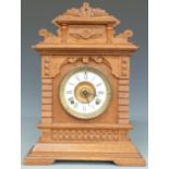 Ansonia oak table/mantel clock in carved case with Roman dial and beetle and poker hands, striking