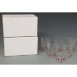 Twelve Giampolo Nason Murano drinking glasses with red decoration, in original boxes