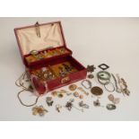 A collection of costume jewellery including watches, marcasite brooches, silver earrings, rose