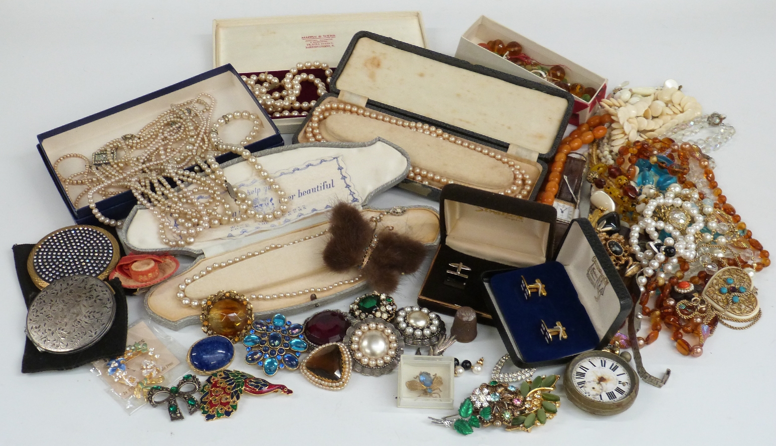 A collection of costume jewellery including beads, brooches, watches, silver handled button hook,