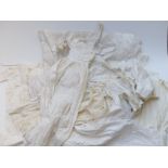 A quantity of mainly 19thC skirts, petticoats and nightclothes, some with lace trim and
