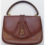 A vintage Gucci brown leather handbag