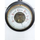 A late 19th/early 20thC circular aneroid barometer, the enamelled dial with red and black