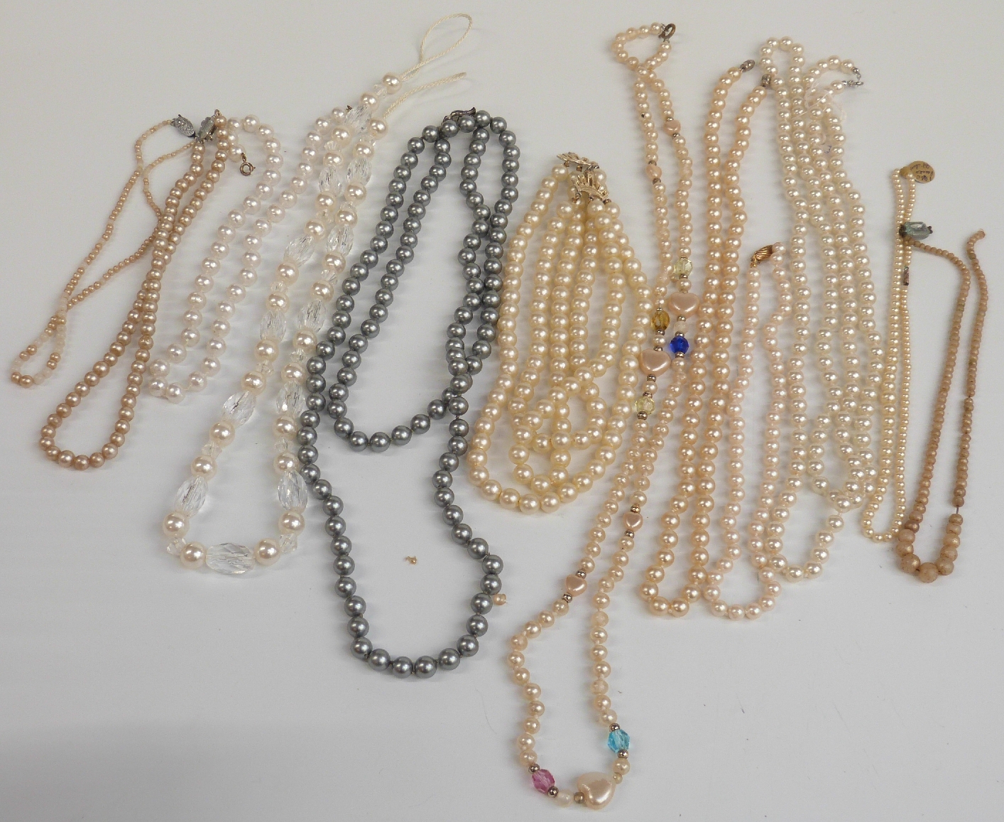 A large collection of costume jewellery including brooches, beads, bracelets, cufflinks, chains, - Image 10 of 14