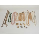 A collection of jewellery including rose quartz necklace, faux pearl necklaces one with a French