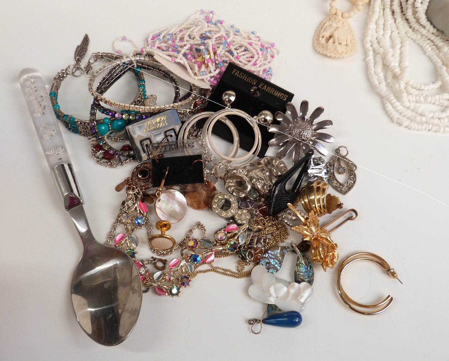 A large collection of costume jewellery including brooches, beads, bracelets, cufflinks, chains, - Image 4 of 14