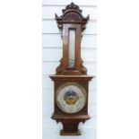 Late 19thC / early 20thC wall aneroid barometer / thermometer combination in carved wooden case,