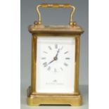 Mathew Norman Swiss made 20thC brass cased carriage clock with corniche style case, white