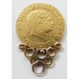 George III 1820 gold full sovereign in mount, 9.1g