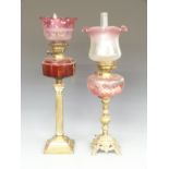 Two Victorian oil lamps converted to electricity with cranberry type glass bowls and etched glass
