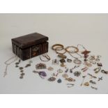 A collection of costume jewellery including rolled gold bangle, Victorian brooch, micro mosaic