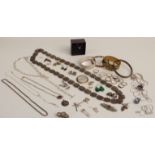 A collection of silver jewellery including flapper bangle, silver chains, pendants, earrings, silver