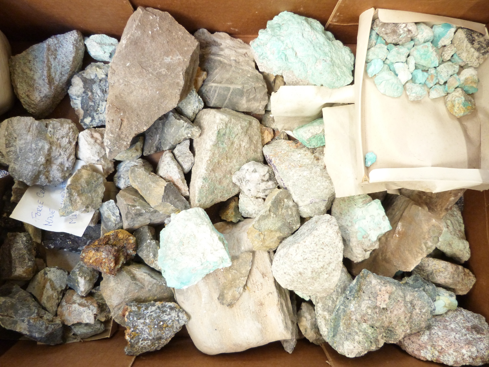 A collection of mineral samples including turquoise, gilbertite mica etc