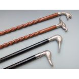 Four walking canes with novelty handles to include three birds and one fish
