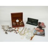 A collection of costume jewellery including necklaces, silver plate spoons, cross, cufflinks, 9ct