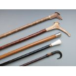 Five various walking canes including horn handled Grindelwald example