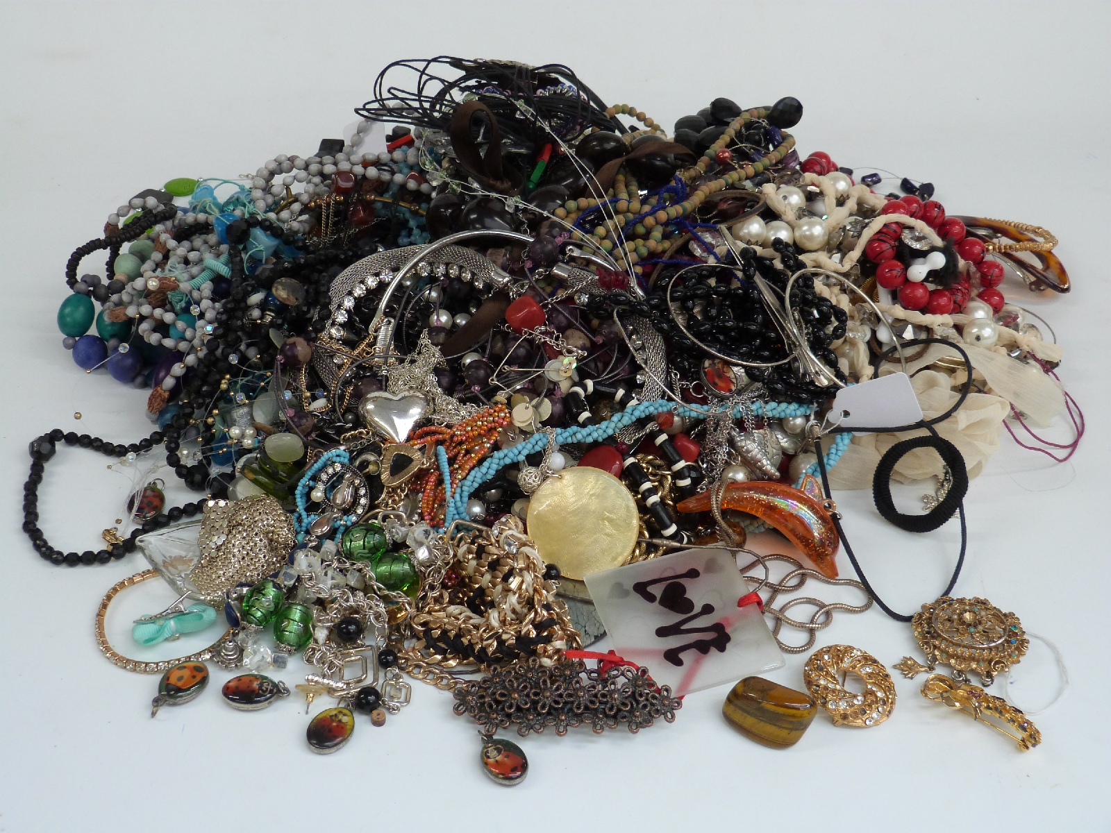 A collection of costume jewellery including beaded necklaces, tiger's eye, etc