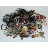 A collection of costume jewellery including beaded necklaces, tiger's eye, etc