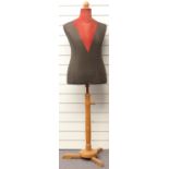 A vintage tailor's dummy raised on a wooden stand, height 153cm