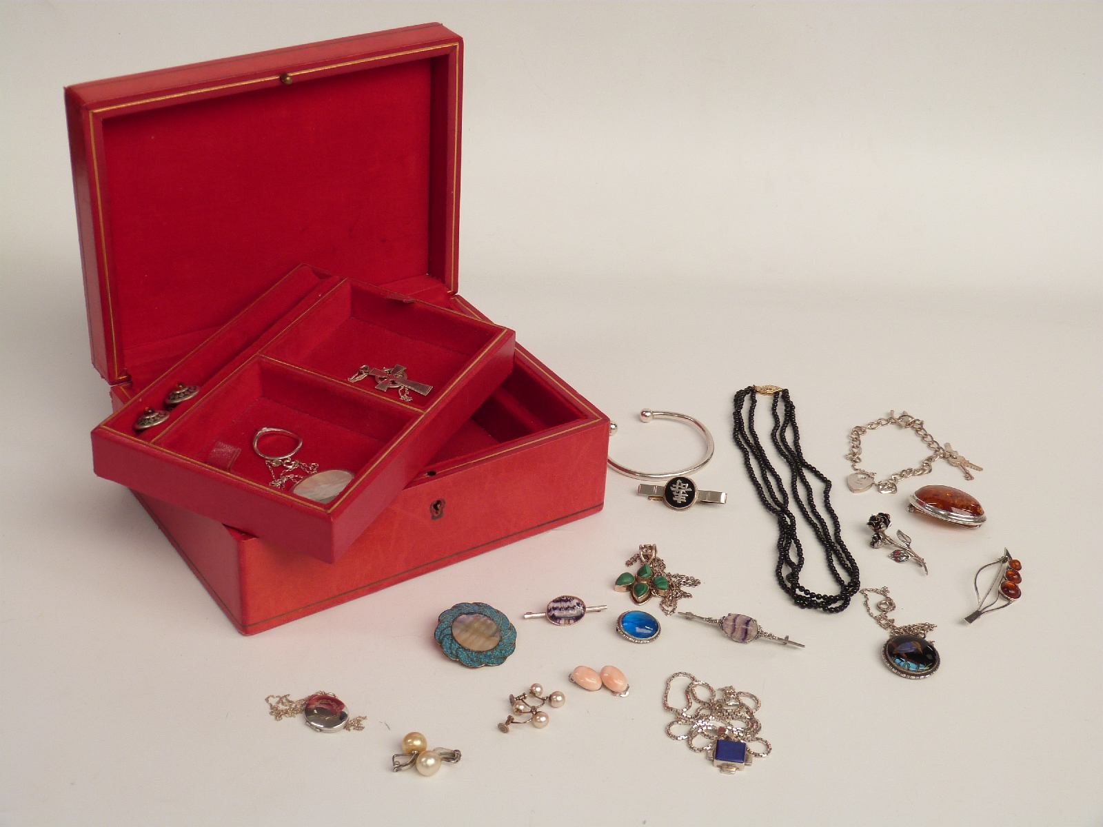 A collection of silver jewellery including butterfly wing, amber, silver ring, silver brooch set
